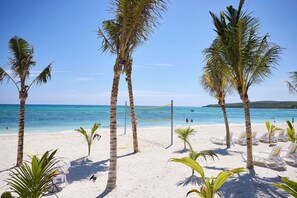On the beach, white sand, sun loungers