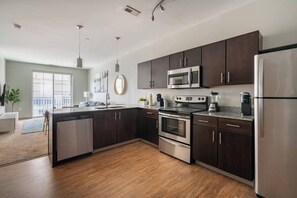 Coffee/tea maker, fridge, microwave, oven