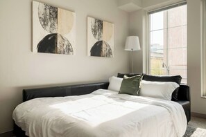 1 bedroom, desk, iron/ironing board, travel crib