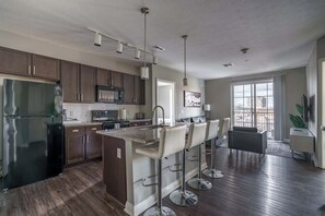 Fridge, microwave, oven, stovetop - Downtown Views from a Stylish 2BR with Balcony (Columbus)