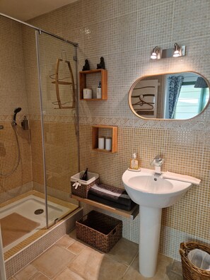 Shower, eco-friendly toiletries, hair dryer, towels