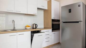 Fridge, microwave, stovetop, cookware/dishes/utensils