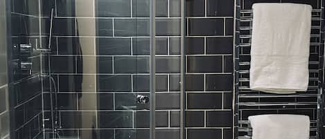 Shower, hair dryer, towels, soap