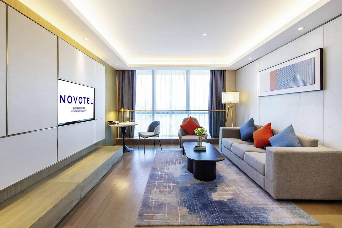 Deluxe Suite, 1 King Bed | Down comforters, free minibar, in-room safe, blackout drapes