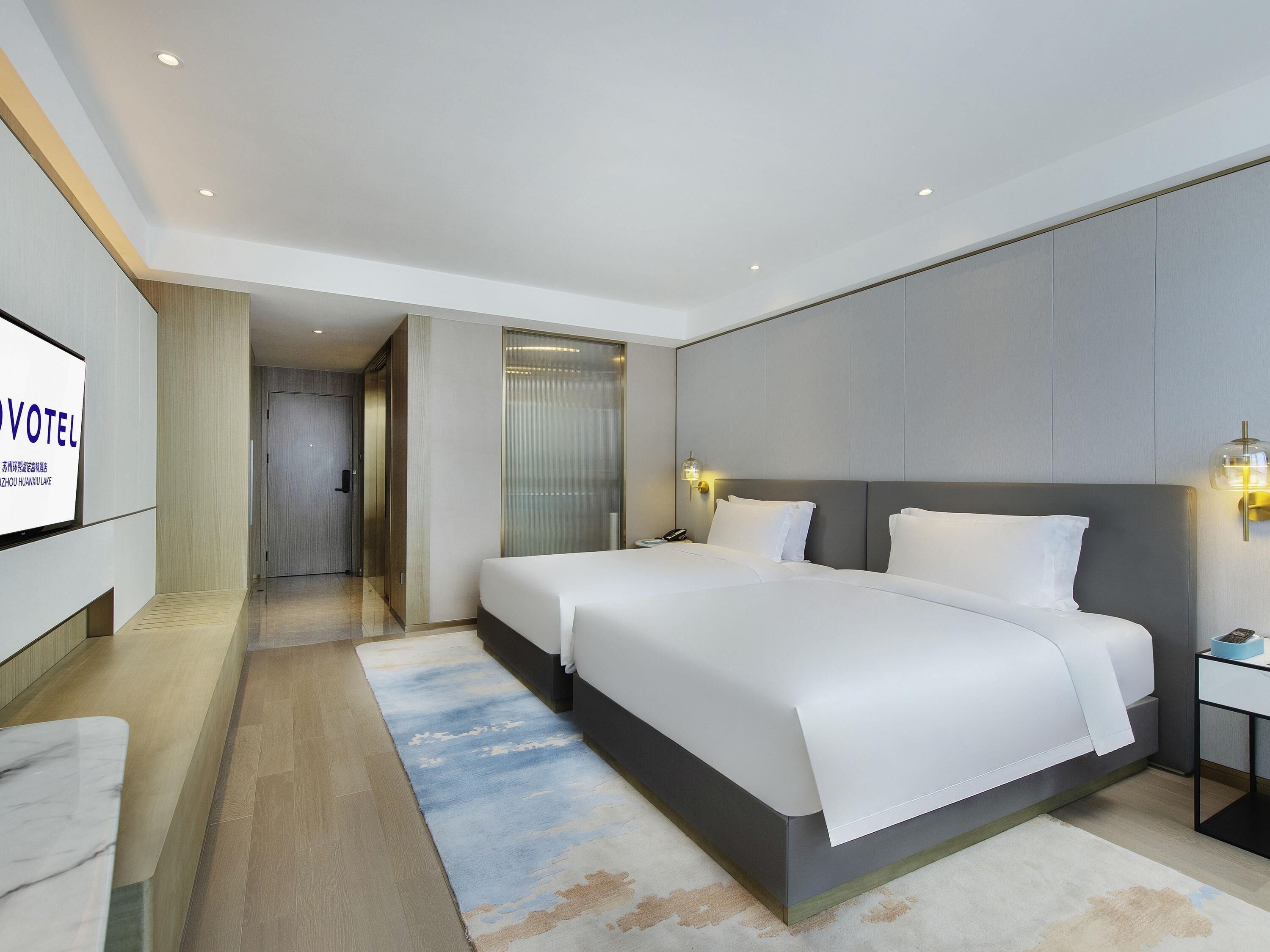 Habitación Deluxe, 2 camas individuales | Edredón y artículos del minibar gratis 
