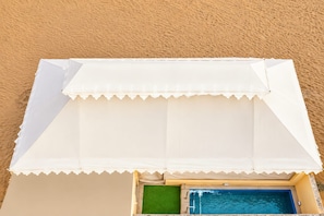 A beachside pool area with a white canopy and a small pool. -  Barkha Desert Safari Camp Sam Sand Dunes (Jaisalmer)