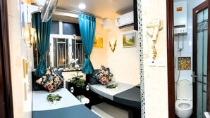 A bathroom with a shower, toilet, and a sink area. - Park Guest House (Kowloon)