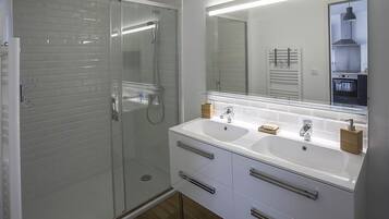 Shower, hair dryer, towels, soap