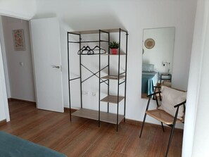 1 bedroom, desk, iron/ironing board, travel crib