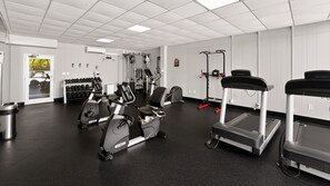 A gym with various exercise equipment including treadmills, stationary bikes, and weight machines. - 114 El Matador 1 Bedroom Condo by RedAwning (Fort Walton Beach)