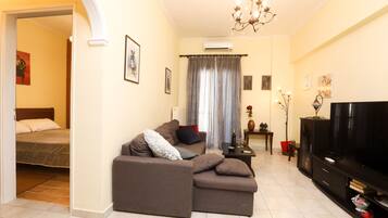 City Apartment | Living area | 45-inch LCD TV with cable channels