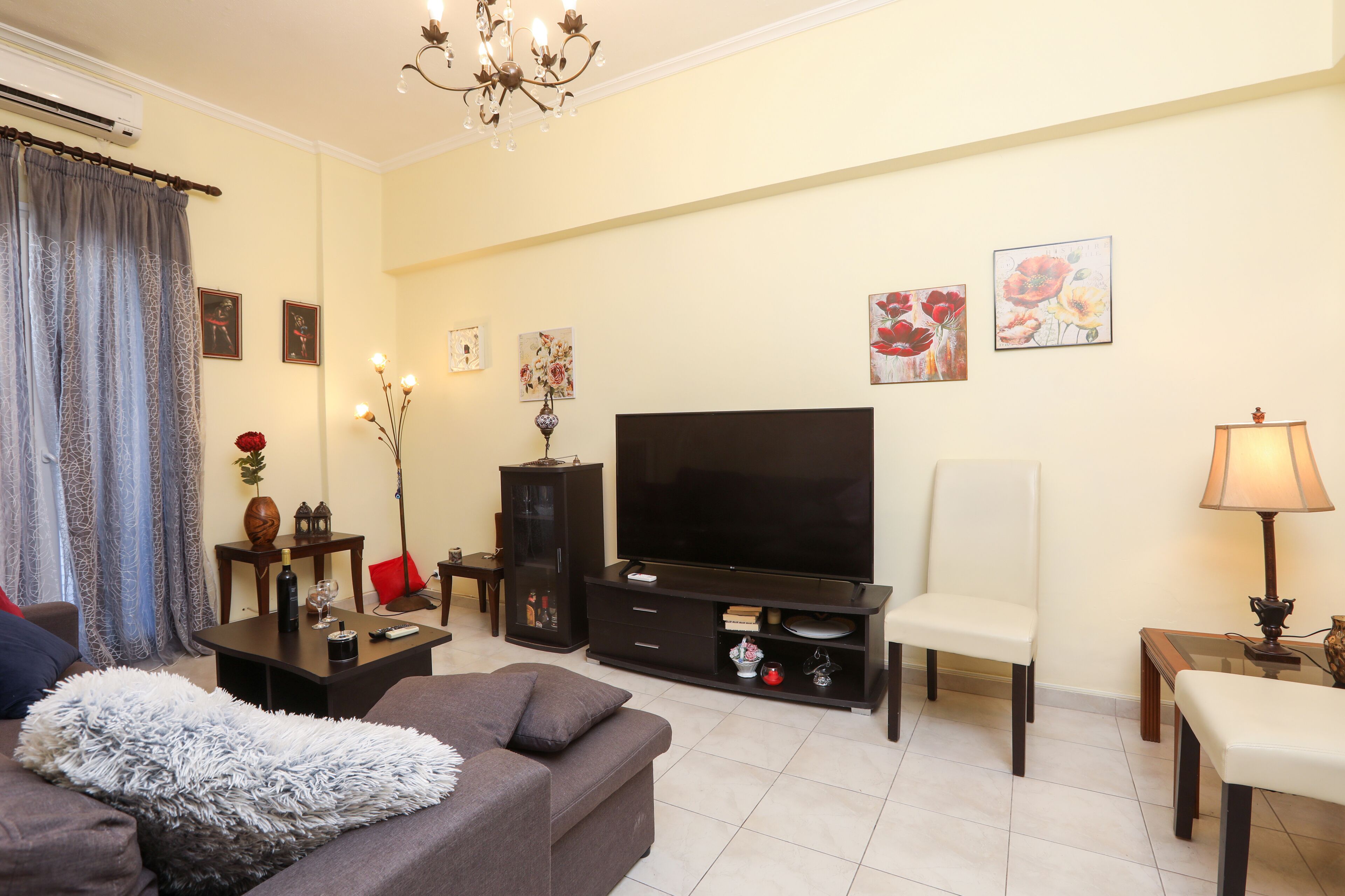 City Apartment | Living area | 45-inch LCD TV with cable channels