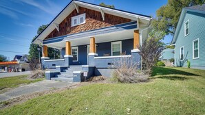 A two-story house with a covered porch, a brick exterior, and a well-maintained lawn. - '1001 Sevier Bungalow': 2 Mi to Neyland Stadium! (Knoxville)