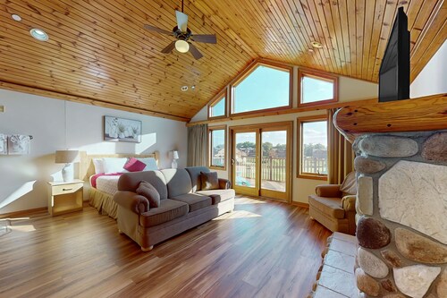 Golf course-front condo with pool, hot tub, dock, tennis, golf, & private beach