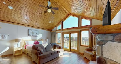 Golf course-front condo with pool, hot tub, dock, tennis, golf, & private beach