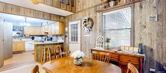 Delightful creekside cabin w/ spacious deck, private hot tub, fire pit, & views