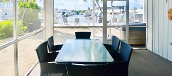 Canal-front home with private dock, hot tub, water views, kayaks, & deck