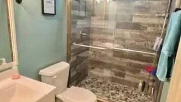 Shower, towels, toilet paper