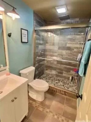 Shower, towels, toilet paper