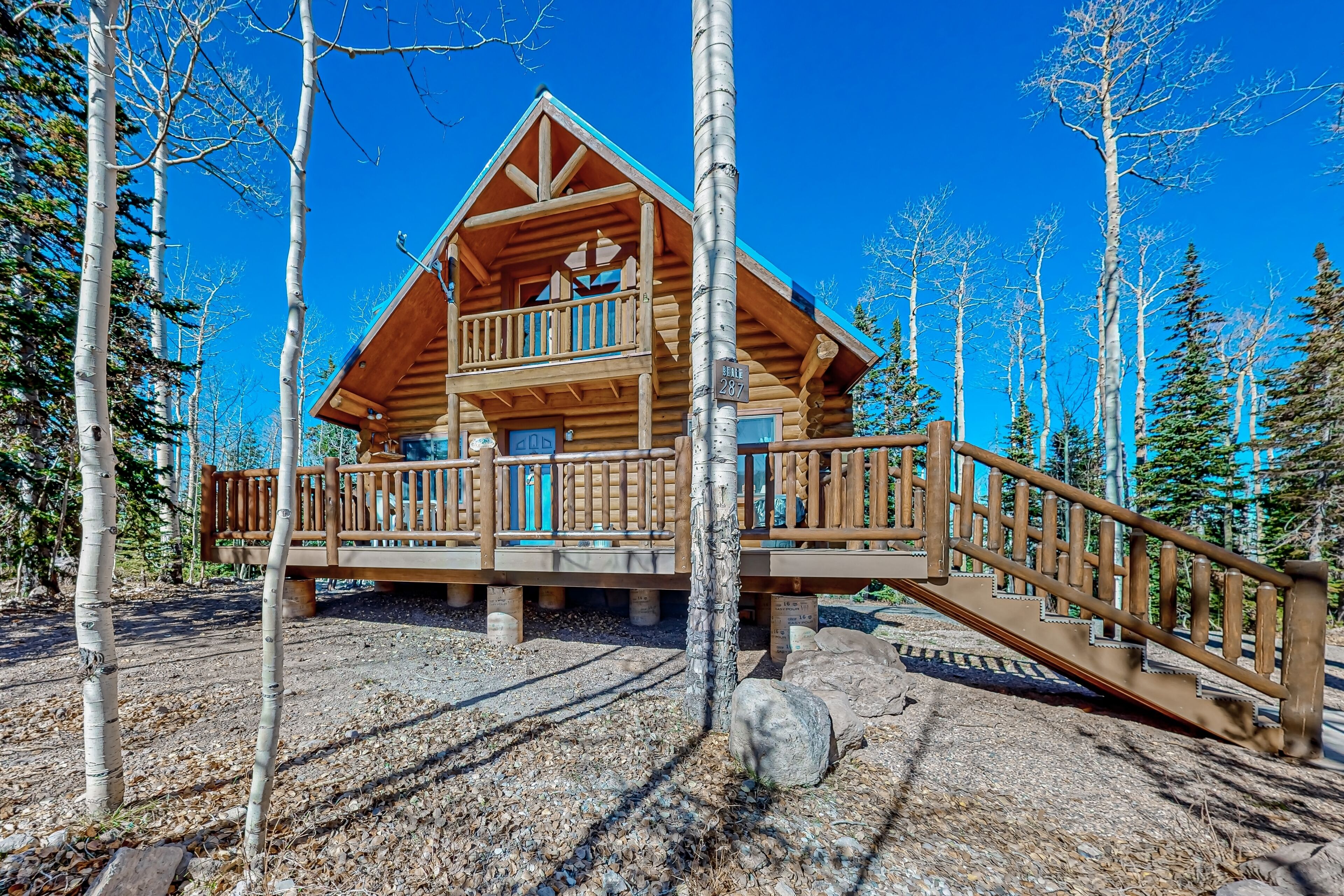 Inviting cabin with fireplace, balcony, central AC, washer/dryer, & grill