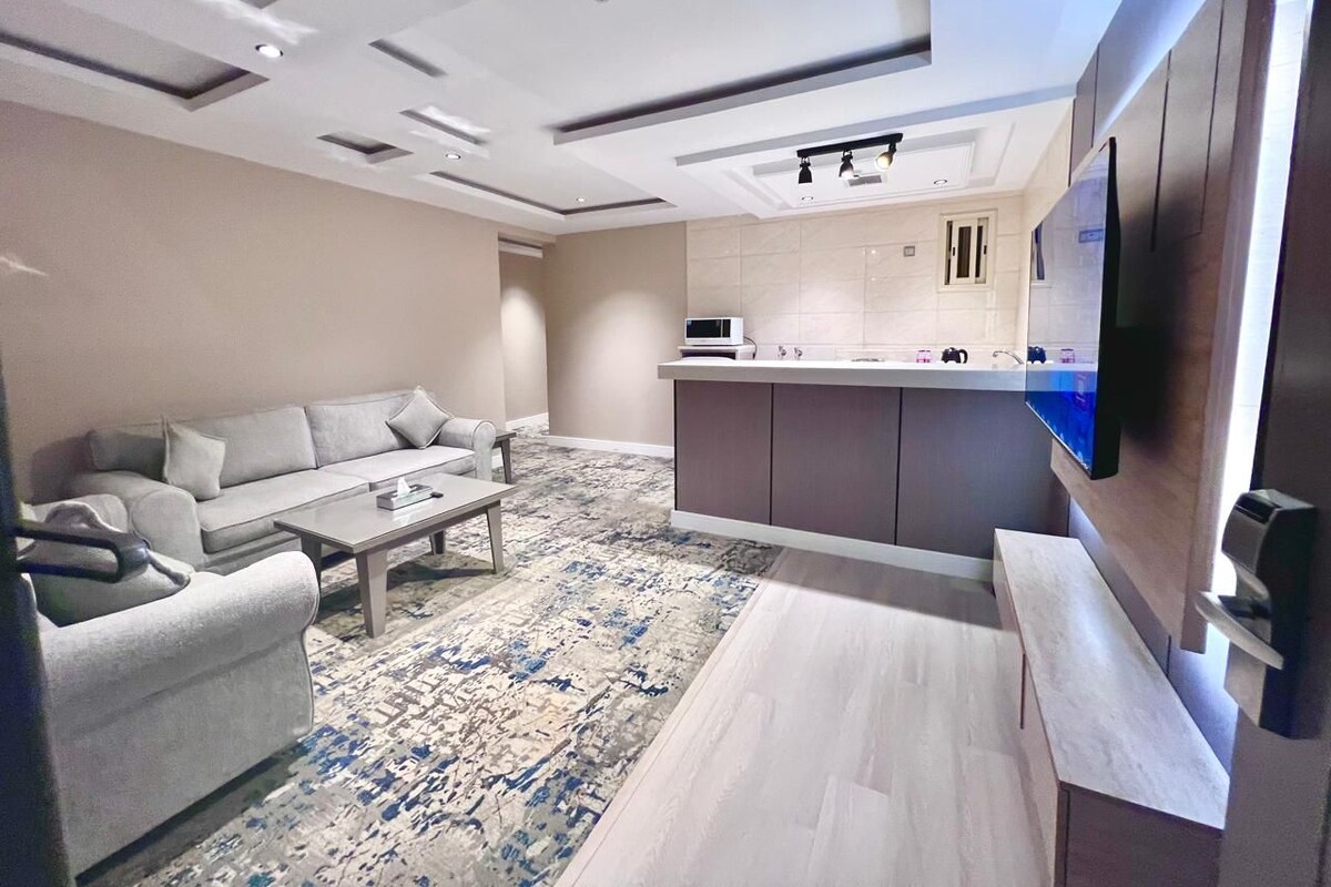 Family Suite, 2 Bedrooms | Living area | 55-inch flat-screen TV with satellite channels