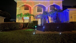 A two-story house with a well-maintained lawn, a driveway, and a garage. - Eagle Dunes gated community. Minutes from Orlando, Disney and Daytona Beach!  (Sorrento)