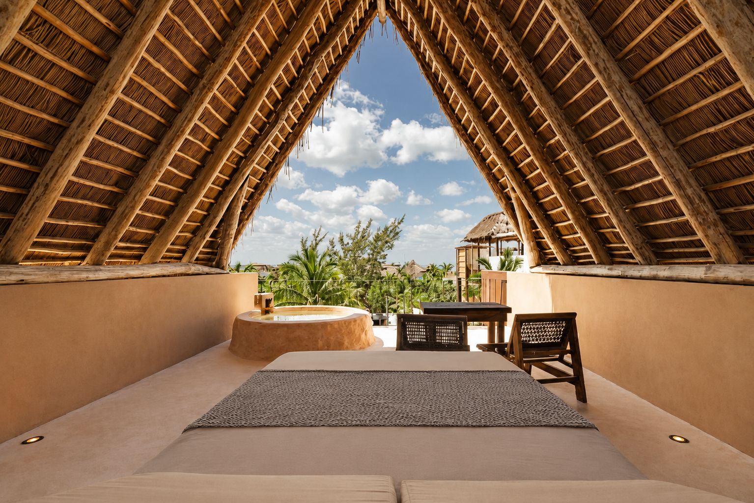 A room with a high, sloped ceiling and a view of palm trees.
