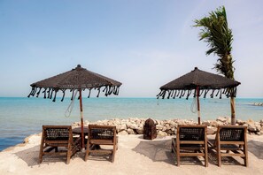 Beach nearby, white sand, sun loungers, beach towels