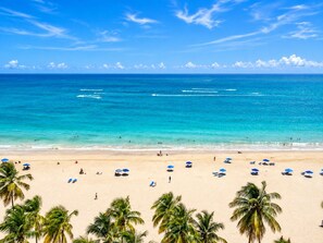Crystal-clear Caribbean waters and sandy beach directly in front of the building - Beachfront 2b/2b  Isla Verde  Marbella Oeste (Carolina)
