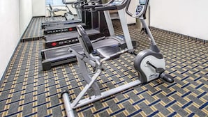 A gym with treadmills, ellipticals, and a stationary bike. - Deluxe Double Room with Two Double Beds - Non-Smoking (Roanoke)