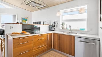 Fridge, stovetop, dishwasher, coffee/tea maker