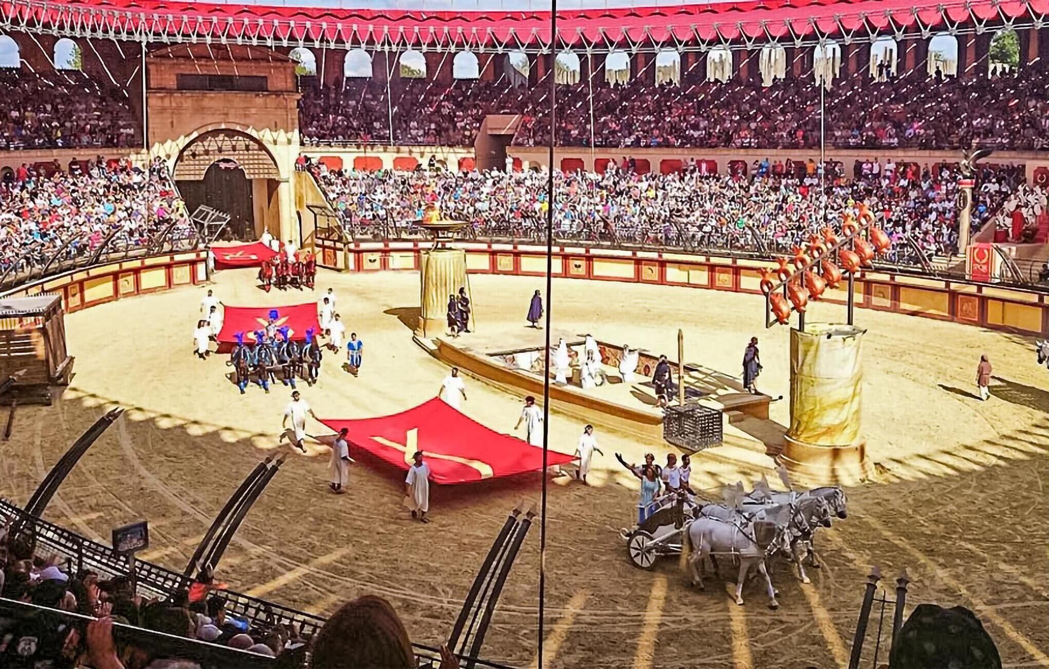 Une arène de corrida avec des spectateurs, un espace central où se déroule le combat et des chevaux.