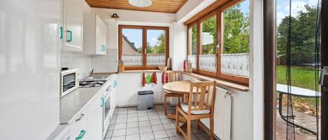 Fridge, stovetop, dishwasher, coffee/tea maker