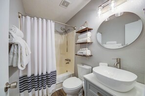 Bathtub, hair dryer, towels