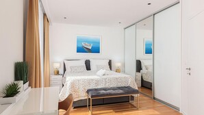 A modern bedroom with a large bed, bedside tables, a bench, and a large mirror. - Lovely home in Dicmo Prisoje (Dicmo Prisoje)