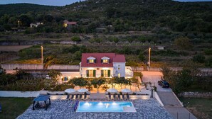 A two-story building with a red roof and a swimming pool in front. - Lovely home in Dicmo Prisoje (Dicmo Prisoje)