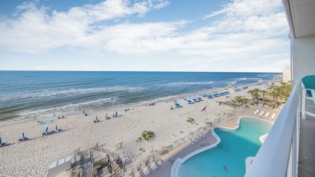 A beach view with a pool, lounge chairs, and umbrellas. - 🌊Gulf Front Condo with Amazing Views-Ocean House 2604🌊 (Gulf Shores)