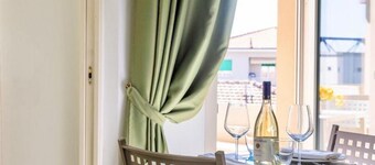 Studio apartment of approximately 20 m2 composed of a living room with kitchenette equipped with 2 induction hobs, small fridge, sink,satellite TV and sofa.Sleeping area separated by sliding door with double bed, bathroom with shower without window.Air c