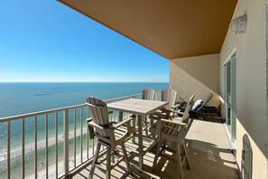 Outdoor dining - Beachfront Penthouse Crystal Shores West 1402 | Beachside Pools, Fitness, Sauna | Beach Getaways (Gulf Shores)