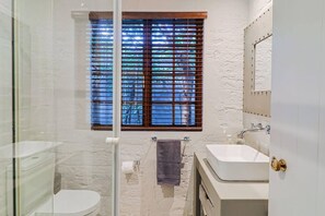 Bathtub, hair dryer, towels, soap