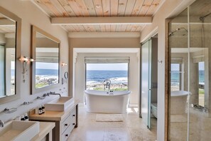 Bathtub, hair dryer, towels, soap