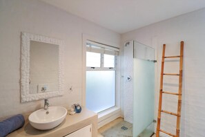 Bathtub, hair dryer, towels, soap