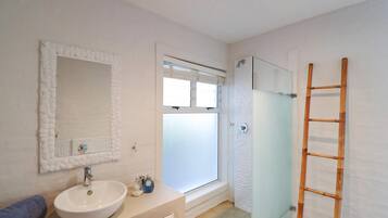 Bathtub, hair dryer, towels, soap