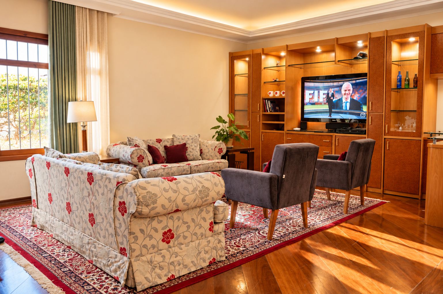 A modern living room with a sofa set, a television, and a wooden cabinet with shelves.