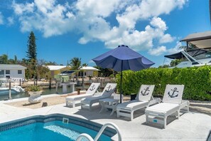 Outdoor pool, a heated pool - Oasis Canal-Front Home: Pool, Dock, BBQ, Wide Canal Boat Access, and more! (Marathon)