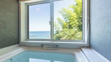 Romantic House | Bathroom | Separate tub and shower, free toiletries, hair dryer, slippers