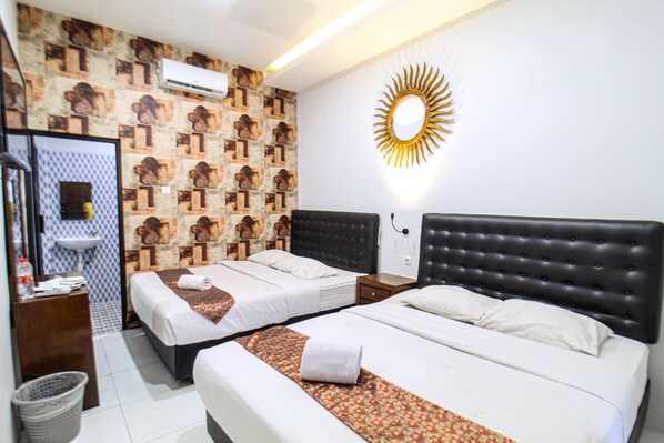 Habitación cuádruple Deluxe | Wifi gratis y ropa de cama