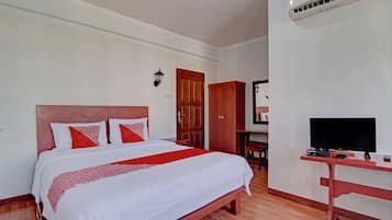 Laptop workspace, bed sheets