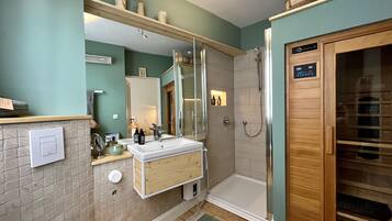 Shower, hair dryer, towels, soap