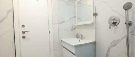 Hair dryer, towels, soap, toilet paper